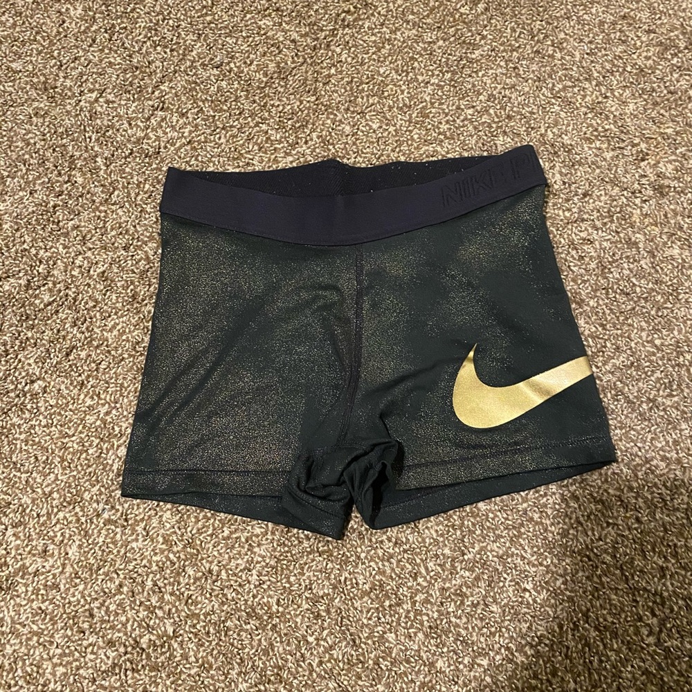 Gold sparkly Nike pros